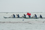 Team rounding the buoy, a rare opportunity for fans to watch both the start and the finish